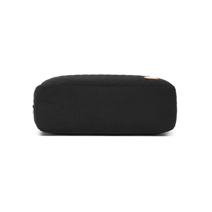 Bottom view of flat rectangular base on black quilted diaper bag with sturdy construction