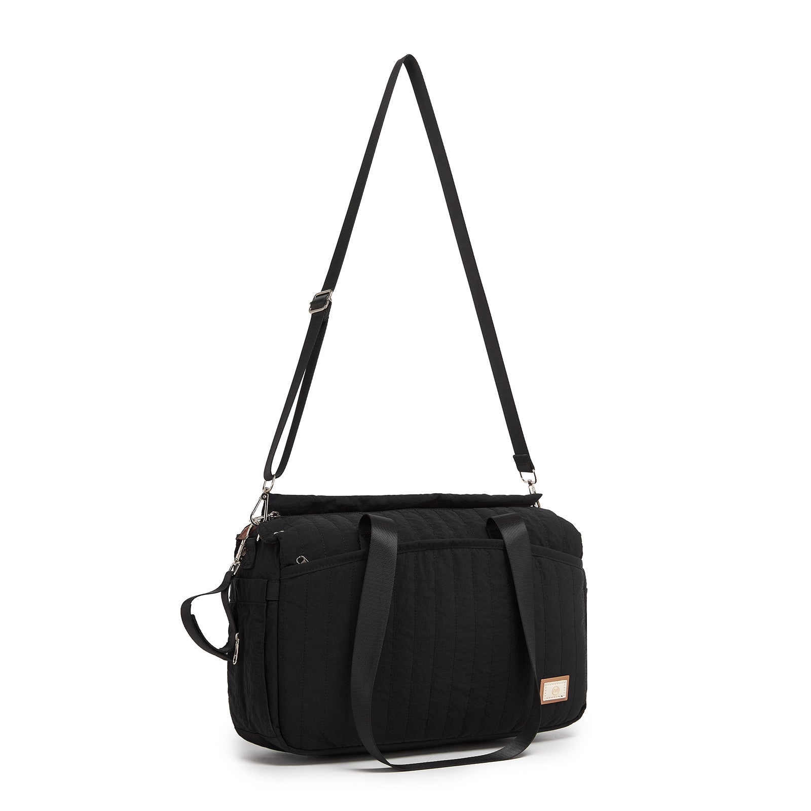Rear view of black structured duffel diaper bag with adjustable trolley strap and silver hardware