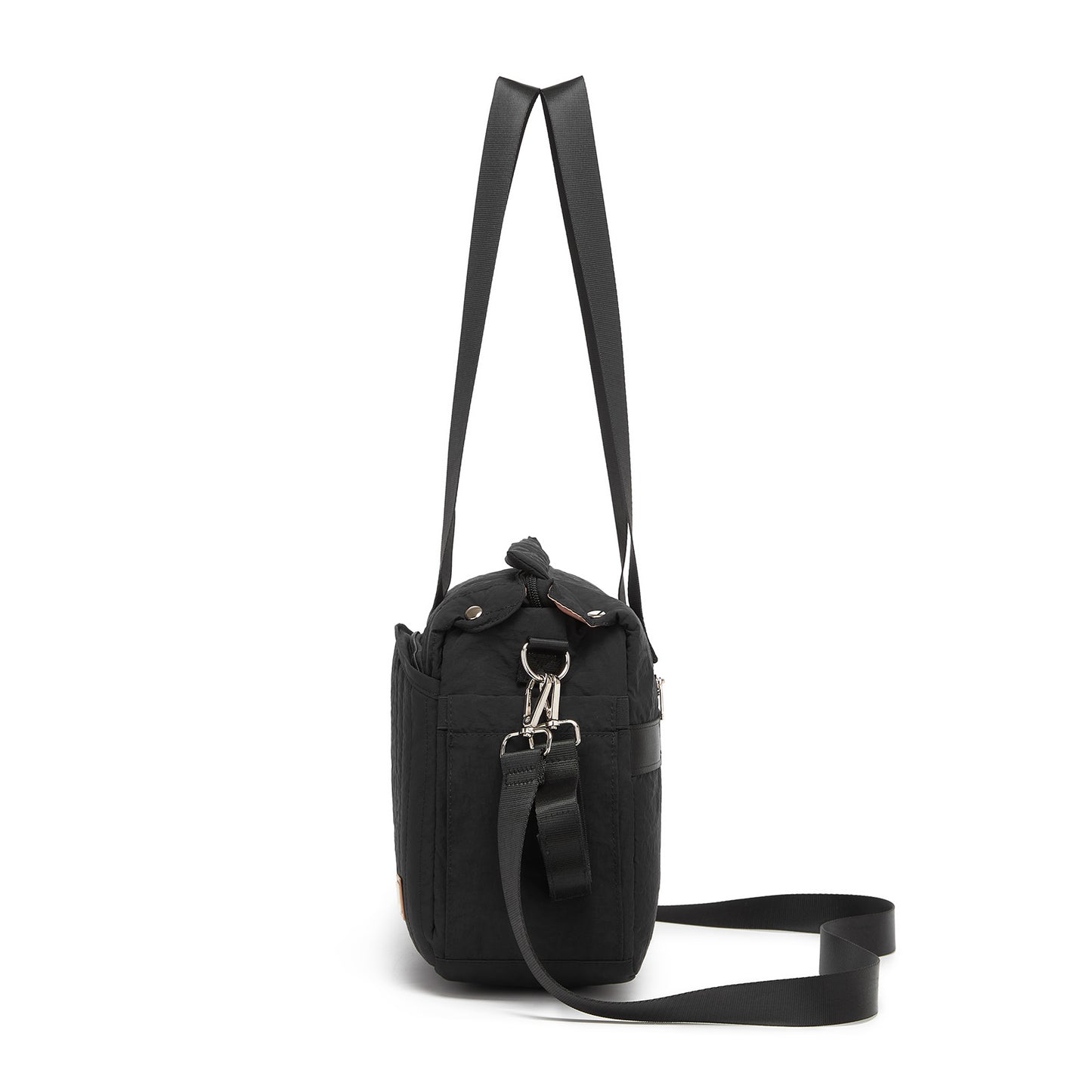 Side profile of structured black diaper bag showing side zipper pocket and detachable strap