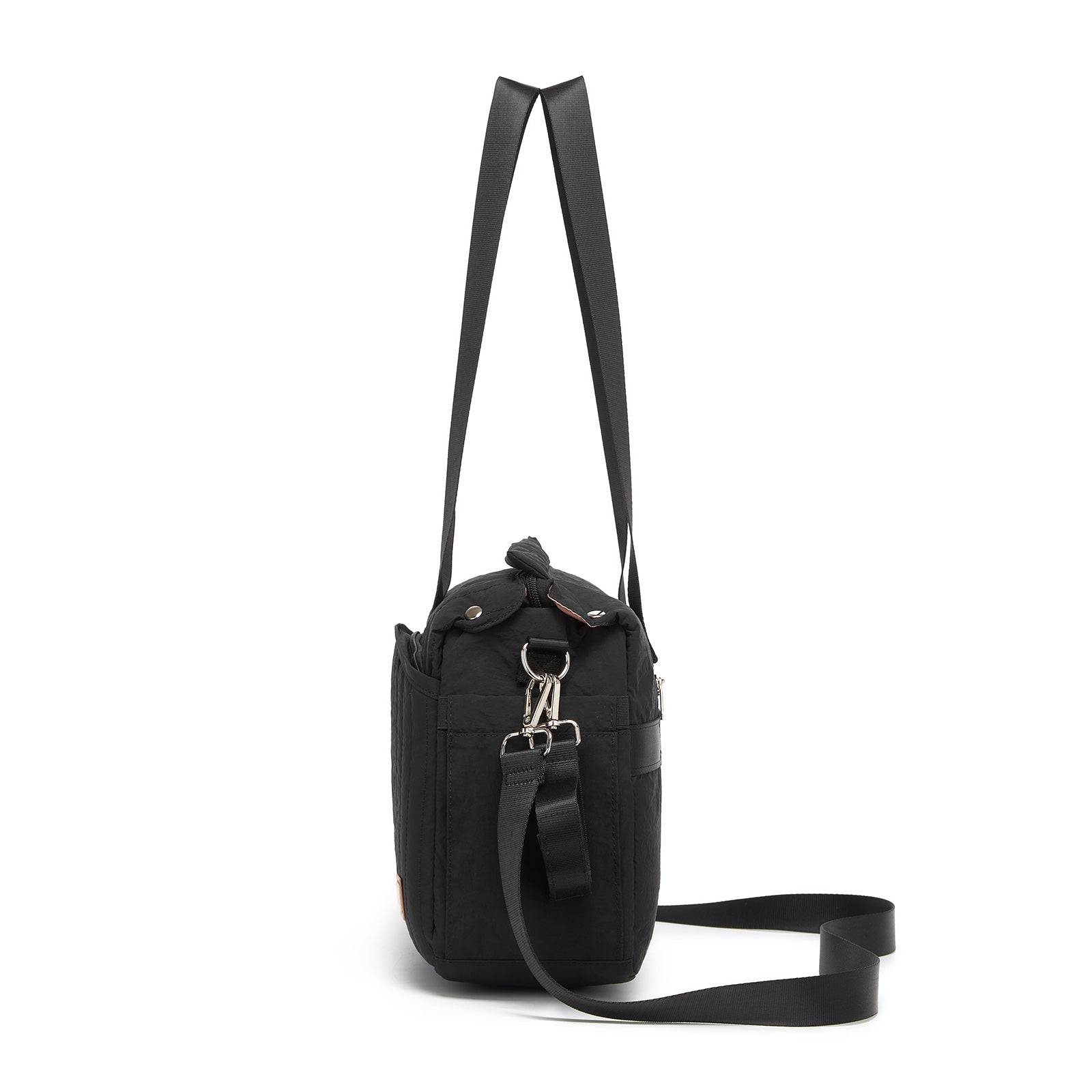 Side profile of structured black diaper bag showing side zipper pocket and detachable strap