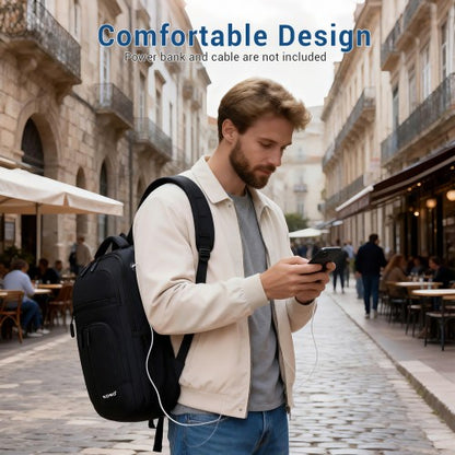 Man wearing black Kono backpack on shoulder in European street setting demonstrating comfortable fit and casual style