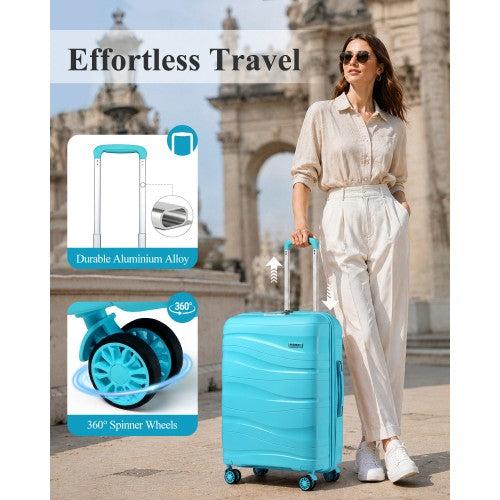 Woman pulling light blue Kono 24-inch suitcase outdoors highlighting 360-degree spinner wheels and aluminum alloy handle