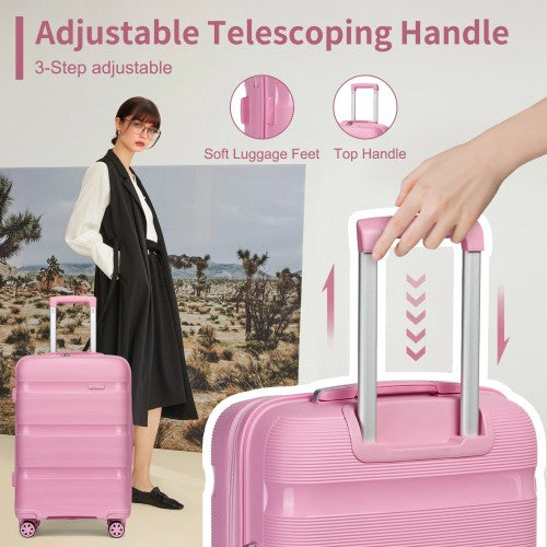 Woman adjusting 3-step telescoping handle on pink 19-inch suitcase with soft luggage feet and top grip visible