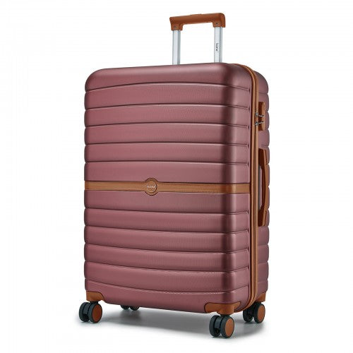 Three-quarter view of burgundy ABS+PC suitcase highlighting vertical ribs and contrasting brown trim details