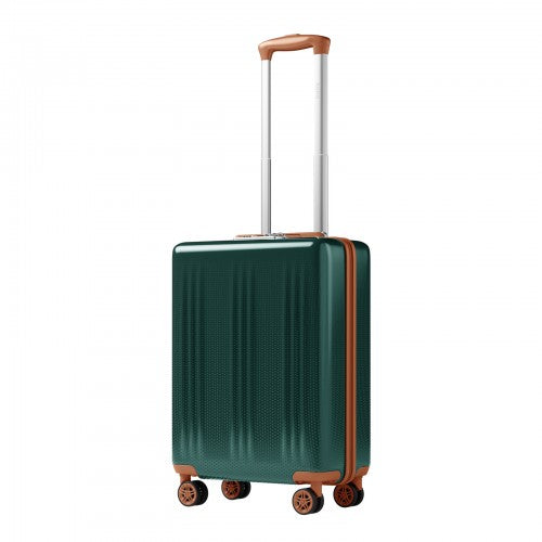 Three quarter angle deep green hard shell suitcase showcasing copper trim vertical ribbing and multi directional spinner wheels