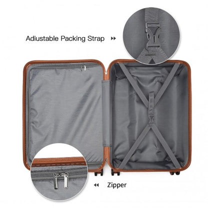 Brown-trimmed suitcase open interior showing adjustable straps and metal zipper teeth