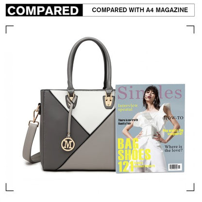 Gray and white geometric Miss Lulu handbag size comparison next to A4 magazine